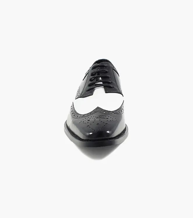 The Stacy Adams TINSLEY Wingtip Oxford in black with white, product number 25092-111, is a stylish shoe crafted from buffalo leather featuring decorative perforations and black laces.