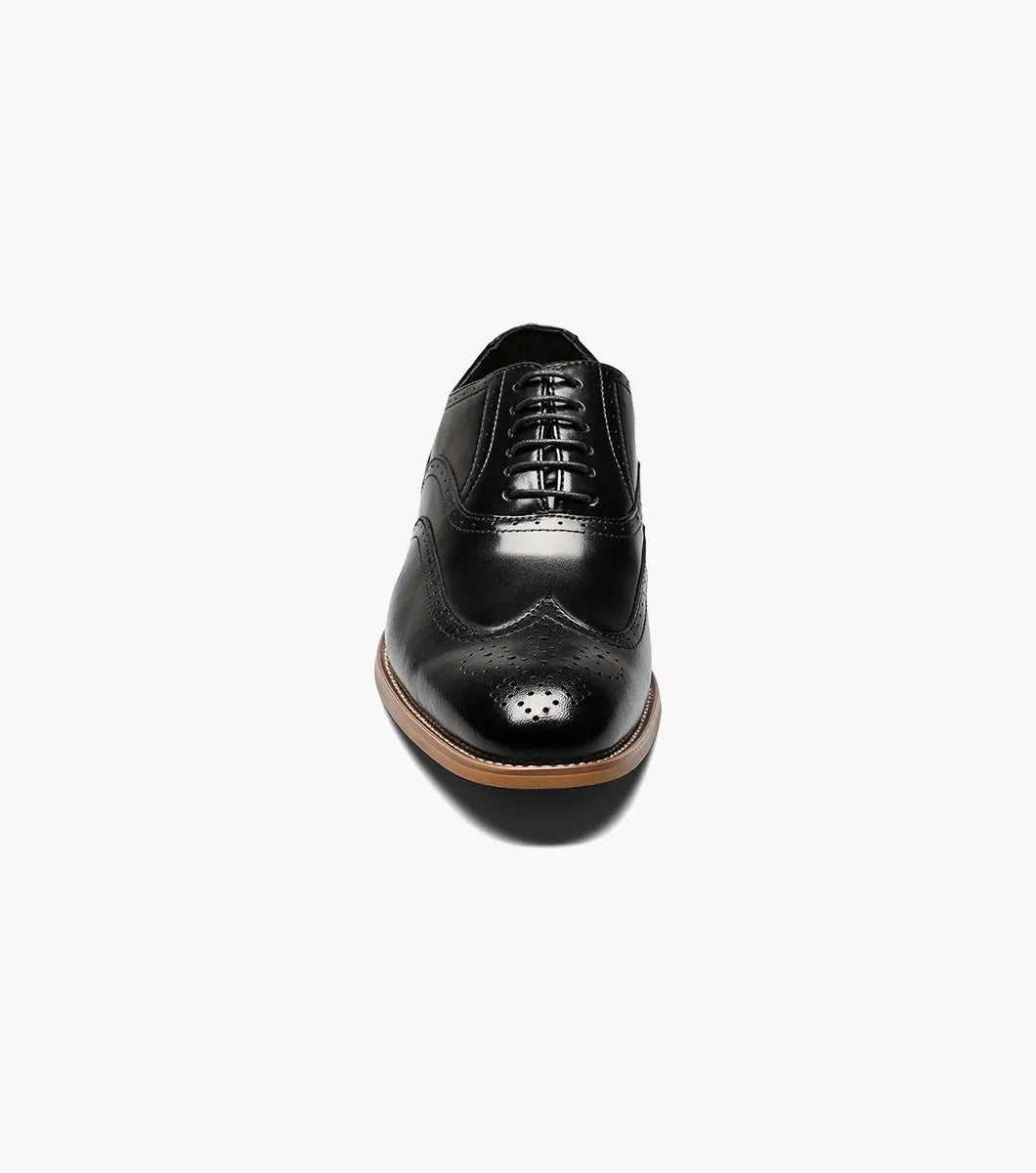 The Stacy Adams DUNBAR Wingtip Oxford in black features decorative perforations, a tan sole, and a comfortable memory foam insole.