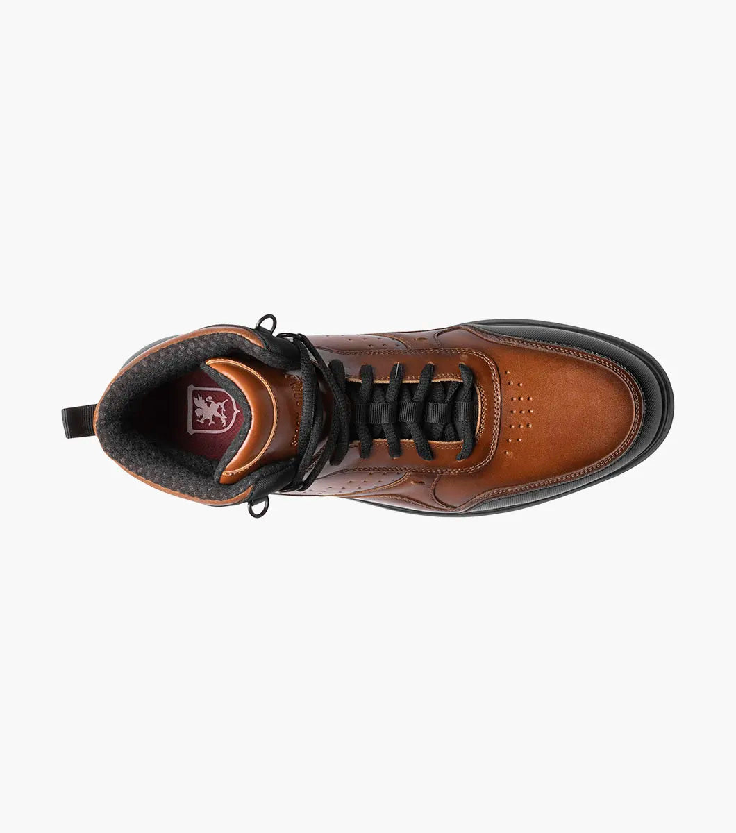 The Stacy Adams MAYSON U-Bal Lace Up Sneaker in Cognac features a brown and black high-top design with black laces and a sturdy yet lightweight EVA sole.