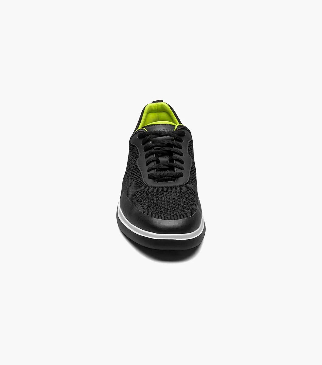 Introducing the Stacy Adams - MAXSON Moc Toe Lace Up Sneaker in black (25517-001) by STACY ADAMS. This stylish sneaker showcases a mesh upper, complemented by a vibrant green interior and a crisp white midsole. Designed for comfort, it features an athletic sole for an easy stride, along with a handy heel pull-tab and coordinating black laces.