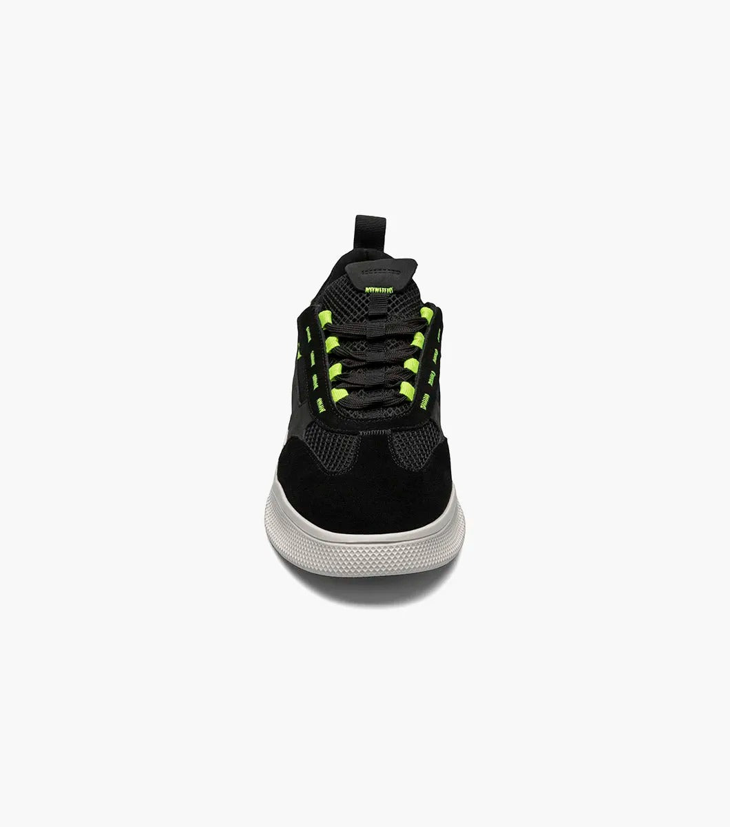 The Stacy Adams Ventura T-Toe Lace Up Sneaker in Black Multi, model 25514-009, combines black and green hues with a white sole for a stylish sneaker design set against a simple backdrop. Crafted for maximum comfort, it incorporates the cutting-edge RedZone removable footbed to make each step feel perfect.