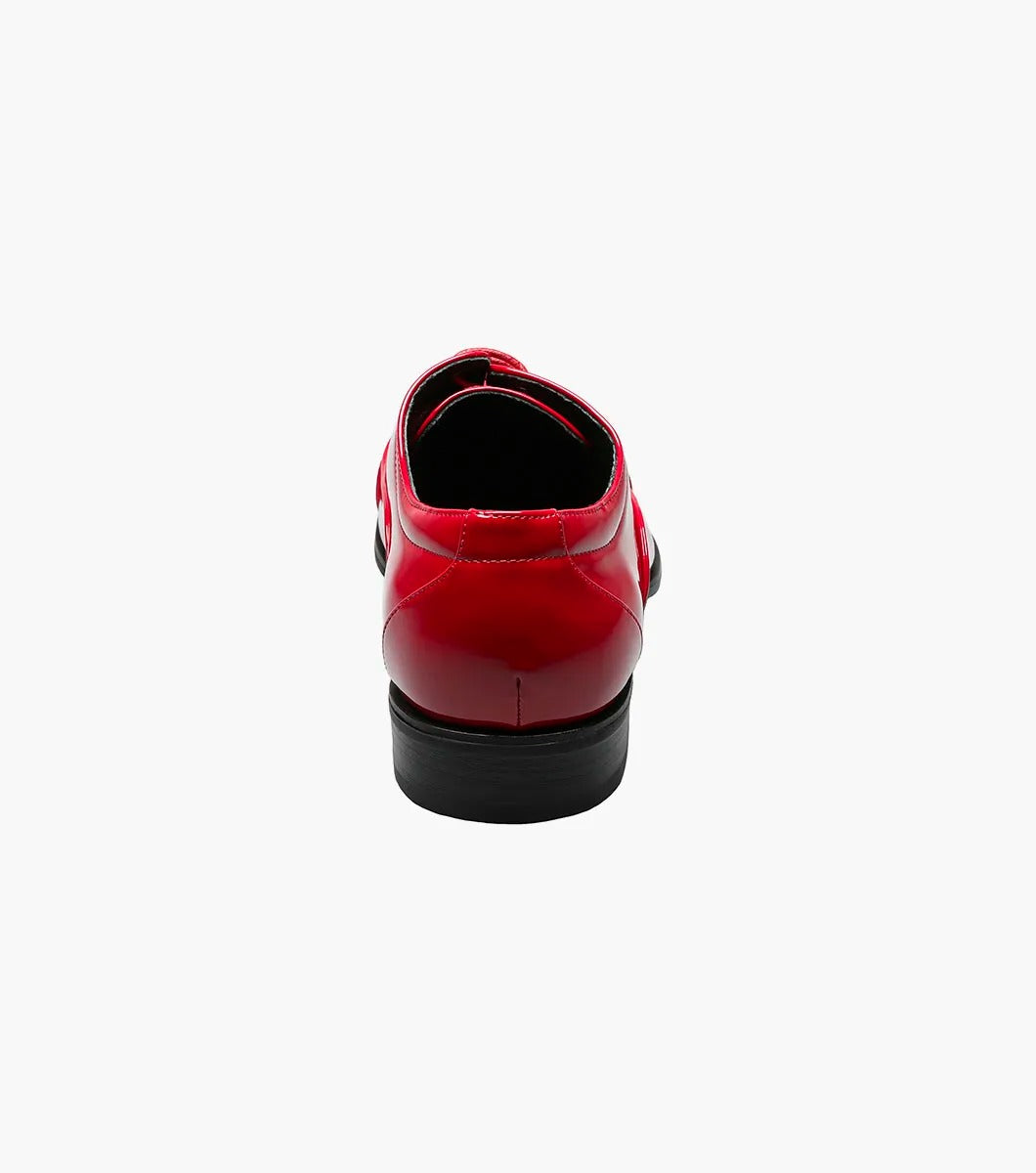 A solitary Stacy Adams GALA Cap Toe Oxford, product number 24998-600, made of shiny red patent leather with black soles and a closed lacing system featuring a memory foam insole, is displayed against a plain white background.