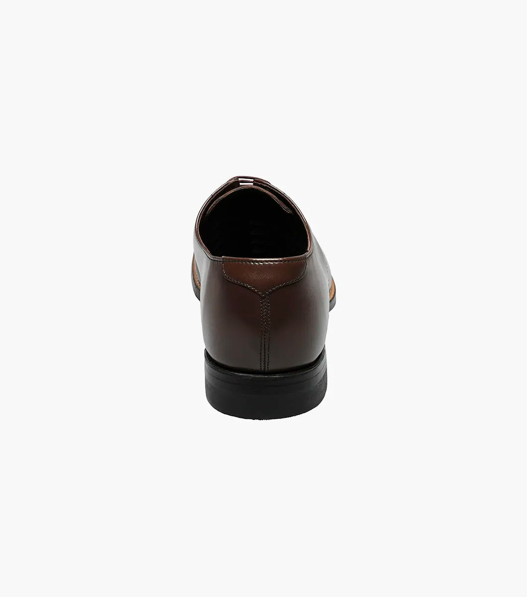 Stacy Adams - MADISON Cap Toe Oxford in luxurious brown kidskin leather, with sleek black laces, gracefully showcased on a white background.