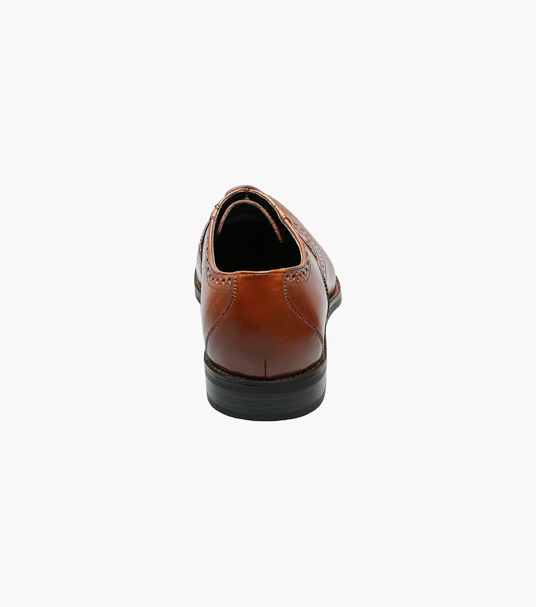 Stacy Adams GARRISON Wingtip Oxford in Cognac, featuring genuine leather with decorative perforations, a black sole, and a cushioned insole for enhanced comfort.