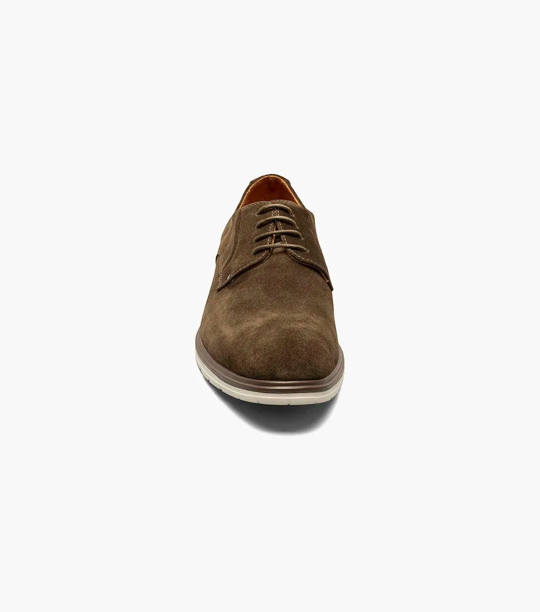 Product: STACY ADAMS presents the TAYSON Plain Toe Lace Up, model 25522-245, featuring a brown suede exterior with a light beige sole and anatomical arch support. This shoe offers a round toe design and laced closure for added comfort and style.