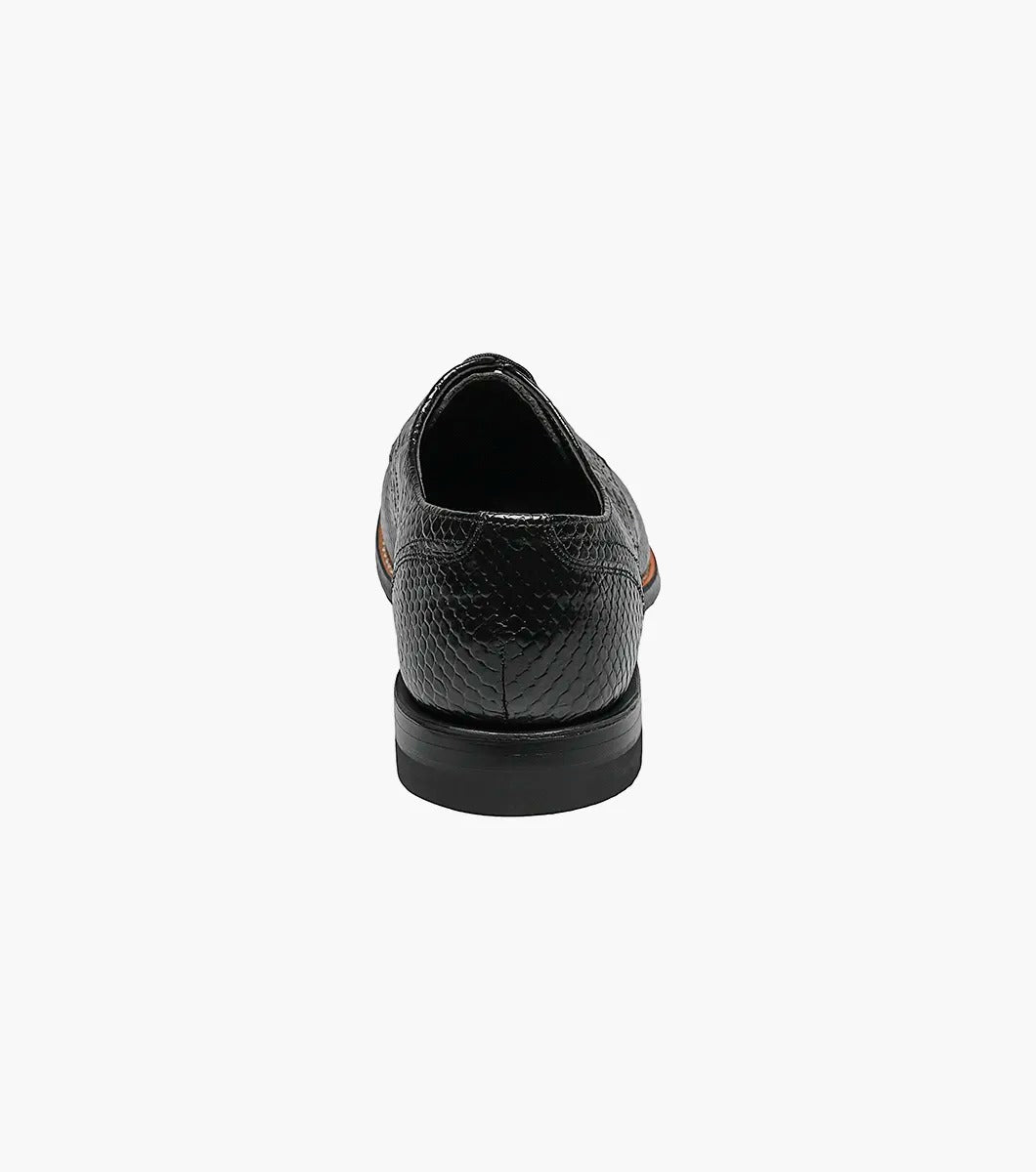 The Stacy Adams MADISON Anaconda Plain Toe Oxford in black showcases a stylish, snake-like pattern with its elegant anaconda print, complemented by a low heel, all displayed on a plain white background.