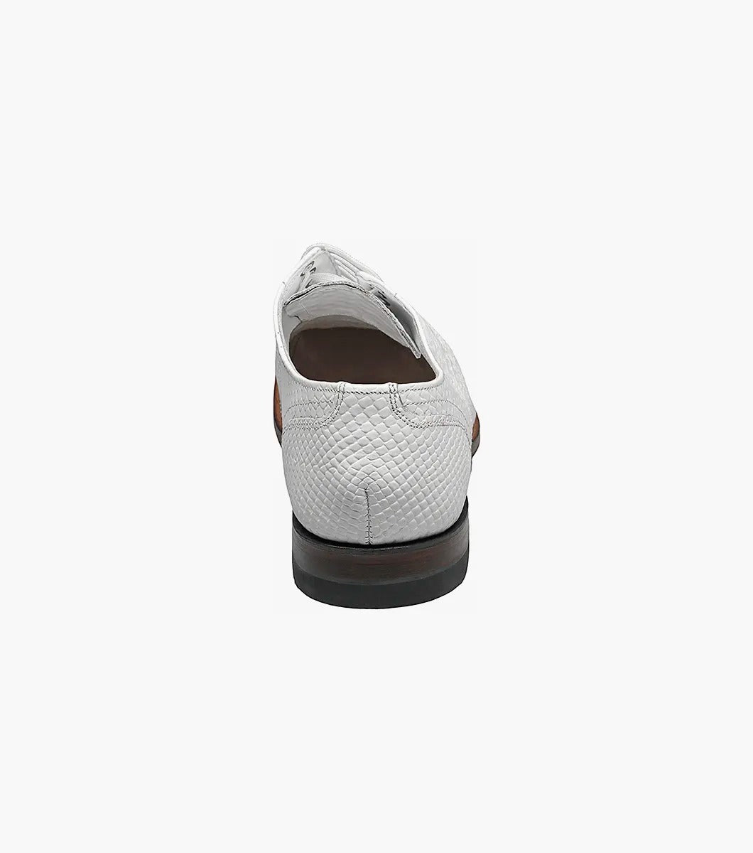 A Stacy Adams MADISON Anaconda Plain Toe Oxford in white, made with textured leather and laces, showcases a low heel and dark sole. It features Goodyear welt construction and is photographed against a white background.