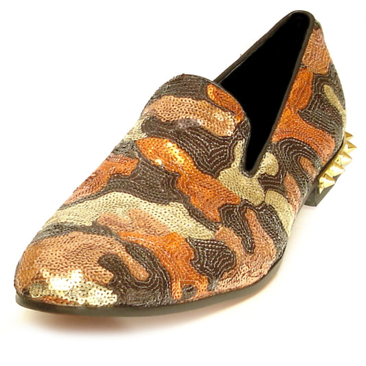 The FI-7033 Brown Fiesso by Aurelio Garcia features a striking camouflage pattern in orange, brown, and gold, adorned with sequins. It showcases a pointed toe and spiked studs on the heel. This fashionable shoe is designed with a luxurious leather upper for an elegant yet eye-catching appearance.