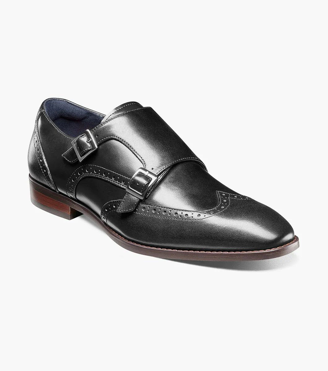 The Stacy Adams KARSON Wingtip Double Monk Strap in black, model 25570-001, features decorative perforations and dual buckles for a stylish look.