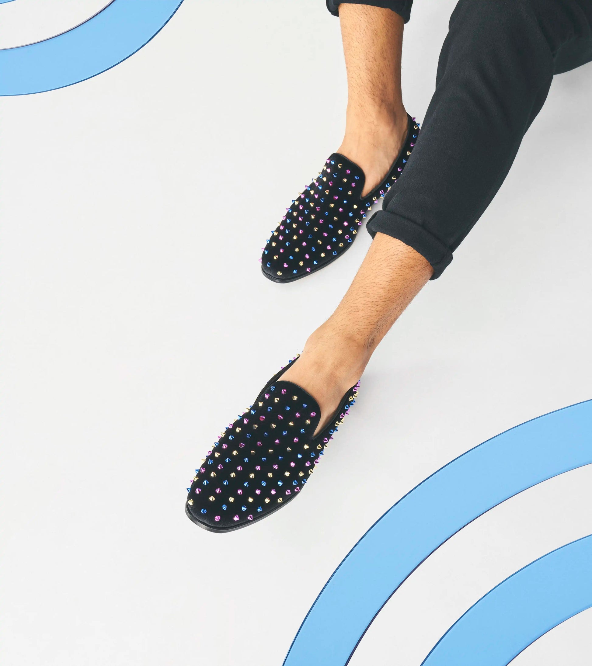 Discover the bold design of the Stacy Adams SPIRE Spiked Slip On in Black/Blue (25532-966). This shoe from STACY ADAMS features vibrant multicolored spikes, a comfortable memory foam insole, and a durable textile upper, seamlessly blending style with practicality.