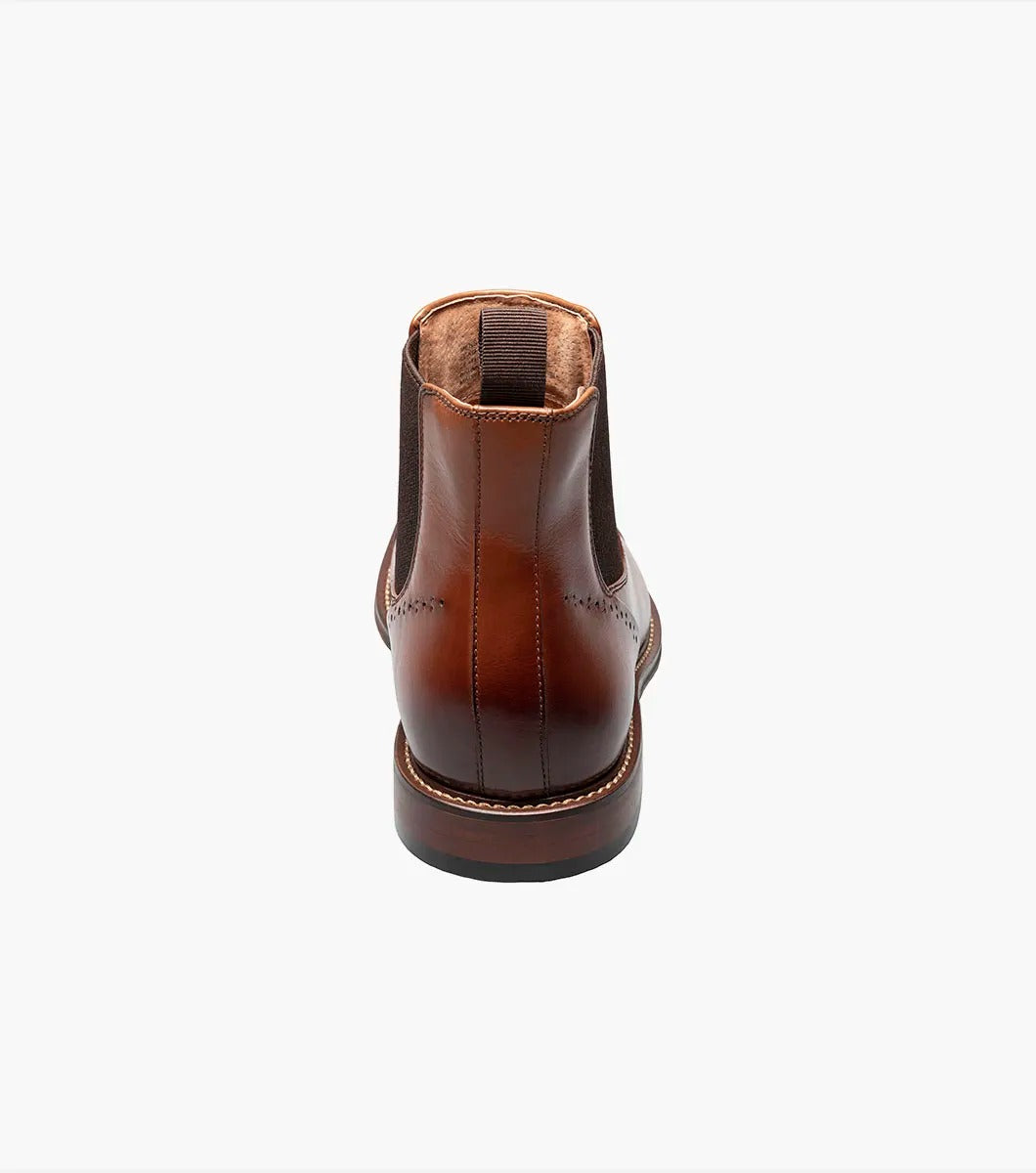 The Stacy Adams MAURY Cap Toe Chelsea Boot in Cognac features ergonomic elastic side panels, anatomical arch support, and a convenient pull tab on the heel.