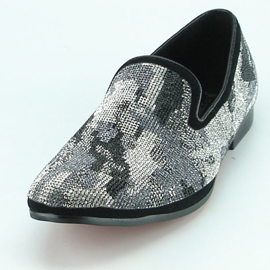 Introducing the FI-7096 Black White by Fiesso, a stylish slip-on fashion shoe featuring a black and gray camouflage pattern. This shoe boasts a slightly pointed toe and includes a cushioned insole for enhanced comfort.