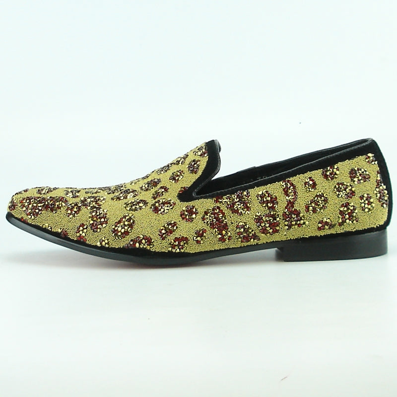 The FI-7097 Gold Fiesso slip-on shoe from Fiesso by Aurelio Garcia features a captivating gold and red leopard print set against a white background, complemented by an elegant leather upper, making it ideal for those looking to make a bold fashion statement.