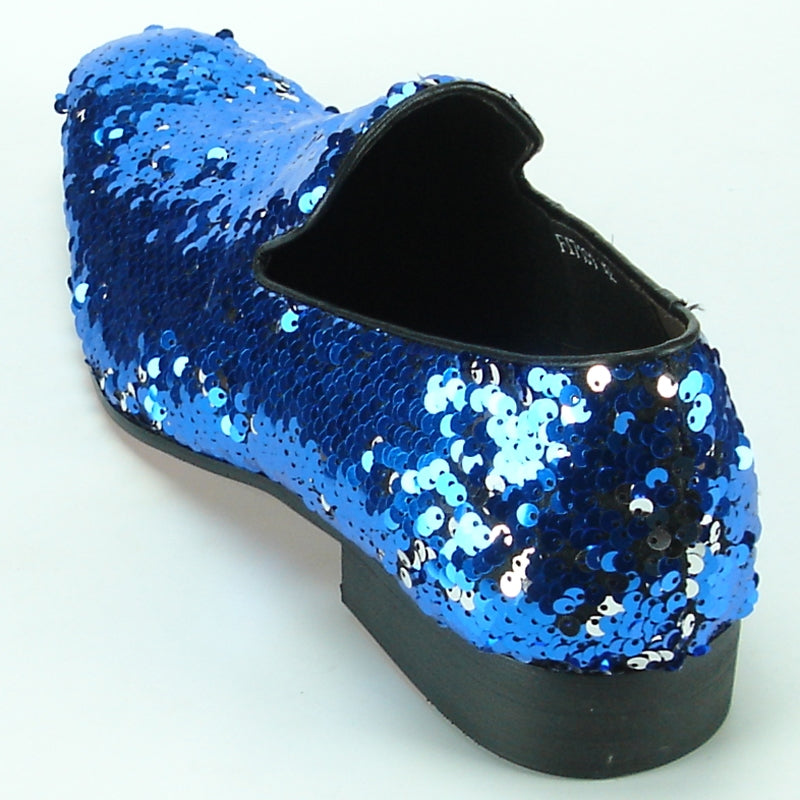 A single FI-7102 Blue Sequins Fiesso by Aurelio Garcia fashion shoe dazzles against a plain background, boasting a pointed toe and low heel. Its upper glimmers with blue sequins, complemented by a luxurious leather lining from the Fiesso brand.