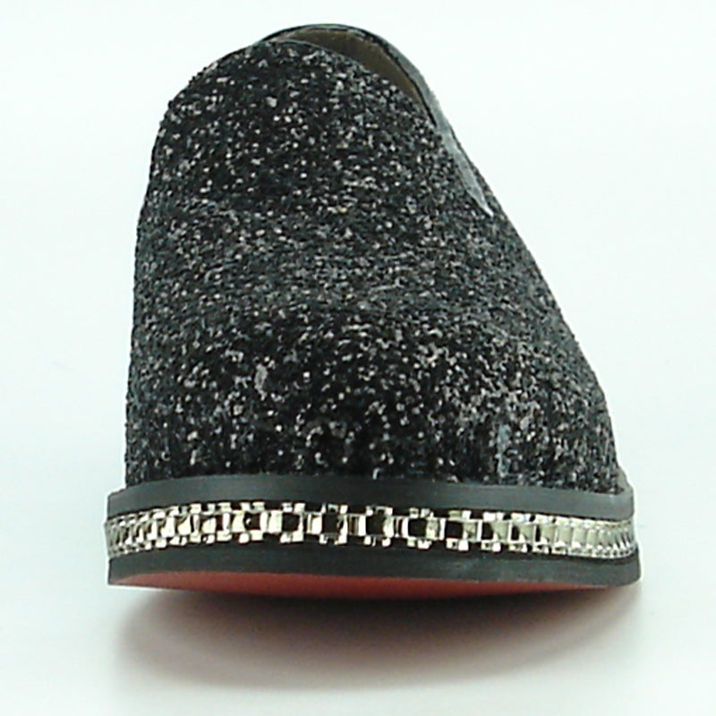 The FI-7118 Black Fiesso by Aurelio Garcia shoes from the Fiesso brand showcase a textured black and gray leather slip-on design, complete with a chunky sole and decorative trim. Ideal for fashion-forward individuals who value comfort without sacrificing style.