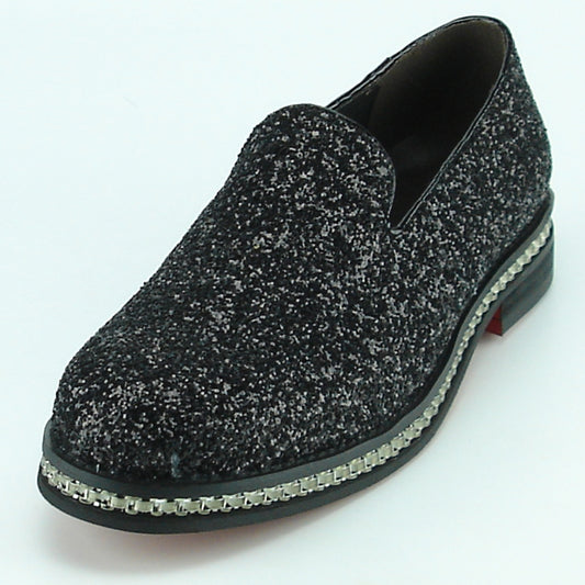 The FI-7118 Black Fiesso by Aurelio Garcia shoes from the Fiesso brand showcase a textured black and gray leather slip-on design, complete with a chunky sole and decorative trim. Ideal for fashion-forward individuals who value comfort without sacrificing style.