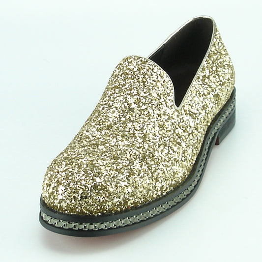 This is a single slip-on fashion shoe with a glittery gold exterior and black sole, boasting decorative stitching and a luxurious leather upper, specifically the FI-7118 Gold model by Fiesso.