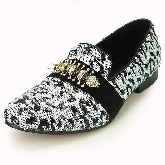 The FI-7025C Black White Fiesso by Aurelio Garcia shoe from Fiesso features a chic black and white sequin design with decorative gold embellishments on the top and offers a cushioned insole for ultimate comfort.