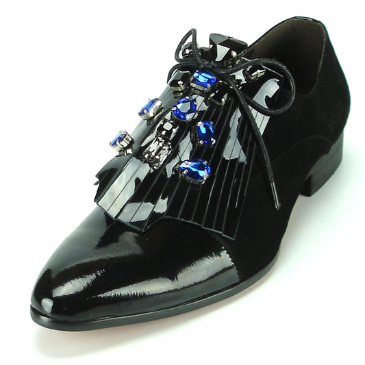 The FI-7111 Black Fiesso By Aurelio Garcia dress shoe by Fiesso showcases elegant black patent leather embellished with decorative blue and black stones, paired with a fringed lace design. Its cushioned insole ensures comfort, making it an excellent choice for any formal event.