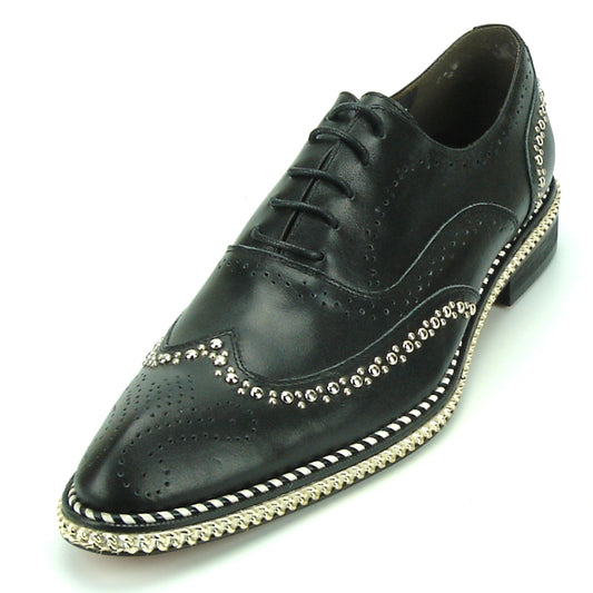 The FI-7201 Black Fiesso by Aurelio Garcia Shoes from the Fiesso brand feature black leather with a wingtip design, cushioned insole, silver stud detailing, decorative brogue pattern, and a braided trim along the sole.