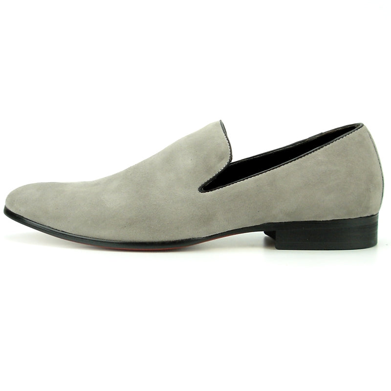 The FI-7216 slip-on loafer from Fiesso showcases a sophisticated grey suede upper by Aurelio Garcia, complemented by a sleek black sole and presented on a pristine white background.