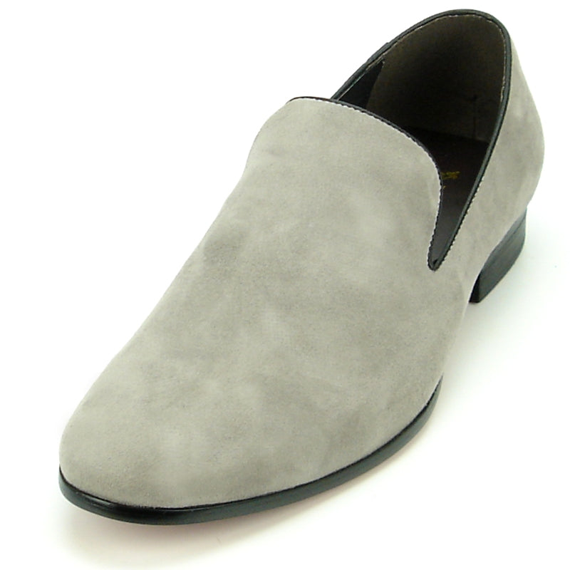 The FI-7216 slip-on loafer from Fiesso showcases a sophisticated grey suede upper by Aurelio Garcia, complemented by a sleek black sole and presented on a pristine white background.