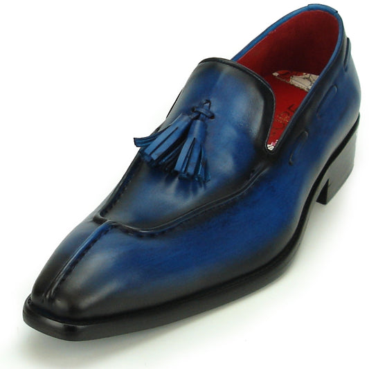 Introducing the FI-8701 Blue Encore by Fiesso, a high-fashion leather loafer adorned with tassels. This exceptional shoe combines elegance and style with its sophisticated red interior lining and sleek black sole, making it perfect for those who truly appreciate quality craftsmanship.