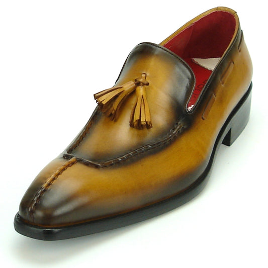 The FI-8701 Tan Encore by Fiesso is a stylish leather tassel loafer with a glossy finish and red interior, showcasing the brand's commitment to high fashion and quality craftsmanship.