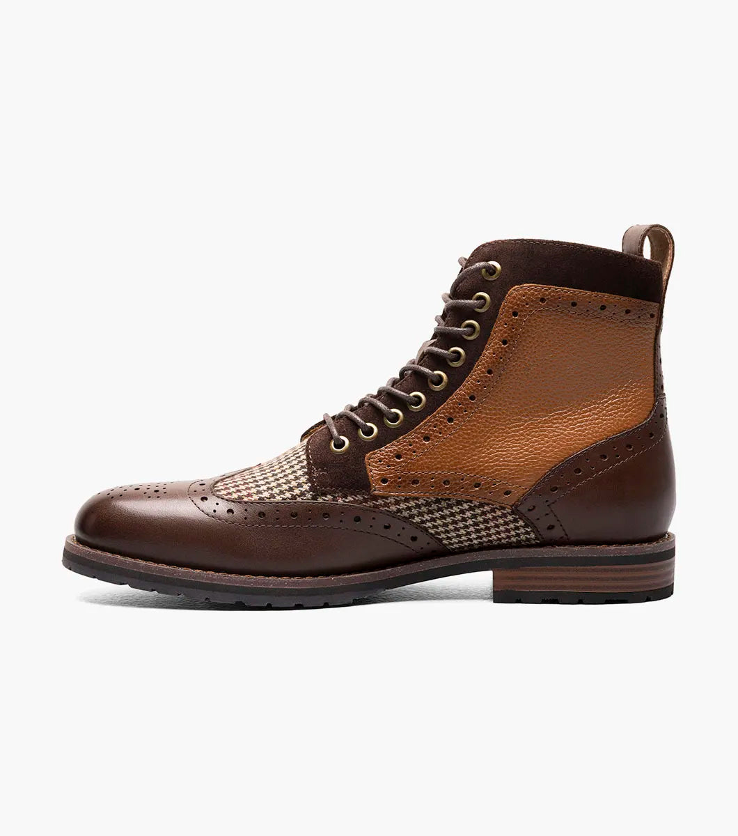 Introducing the Stacy Adams OSWYN Wingtip Lace Up Boot in Brown Multi. This stylish boot from STACY ADAMS features a combination of brown leather and tweed with intricate perforations, a mixed material upper, and a textured sole for unmatched comfort. Enhanced with a Memory Foam insole, these lace-ups provide superior cushioning and support for all-day wear. Product code: 25552-249.