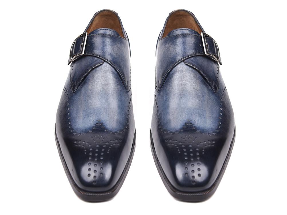 The Paul Parkman Wingtip Single Monkstraps Navy - 98F54-NVY are a pair of elegant navy leather dress shoes with brogue detailing and a monkstrap buckle, displayed on a white background. These handmade shoes from Paul Parkman are perfect for adding a touch of sophistication to any ensemble.