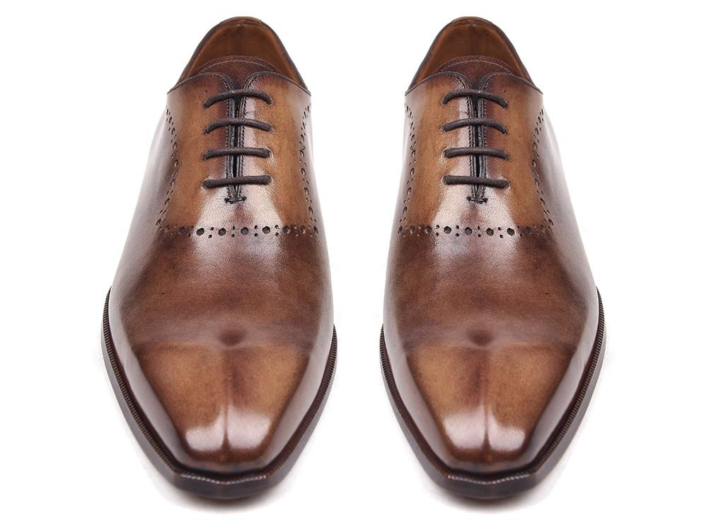 A pair of Paul Parkman Antique Brown Oxfords, featuring decorative perforations and black laces, are crafted from antique burnished leather for a timeless finish.