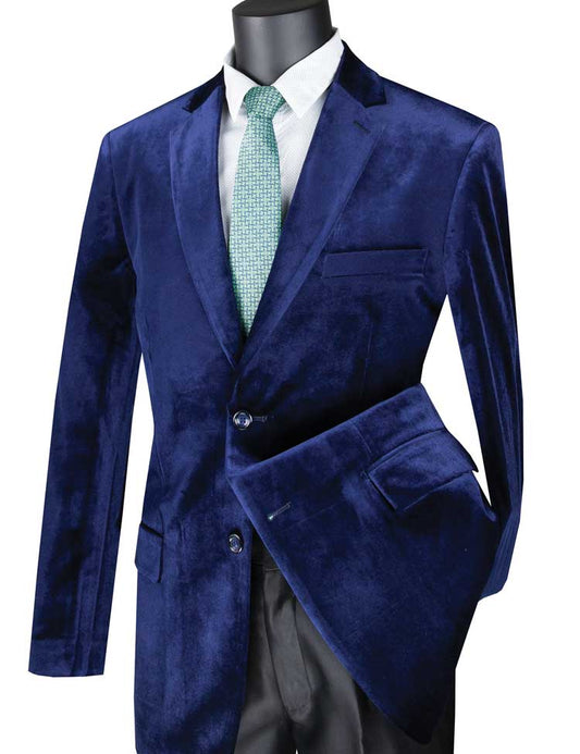 Displayed elegantly on a mannequin is the stylish Vinci Velvet Regular Fit Fashion Jacket (Sapphire) B-27 by Vinci Suits, paired with a green tie and crisp white shirt.