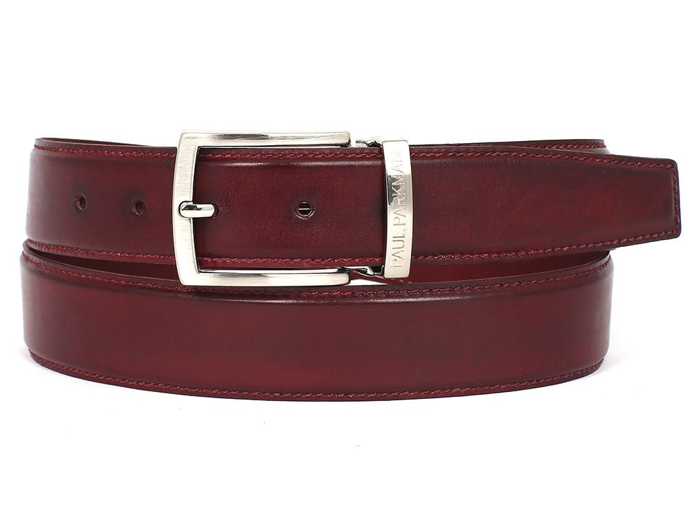 The Paul Parkman Leather Belt Hand-Painted Bordeaux - B01-BRD by Paul Parkman is an exquisite red accessory made from luxurious Italian calfskin leather. It features a silver rectangular buckle and multiple holes for adjustment, offering the perfect blend of style and personalization.