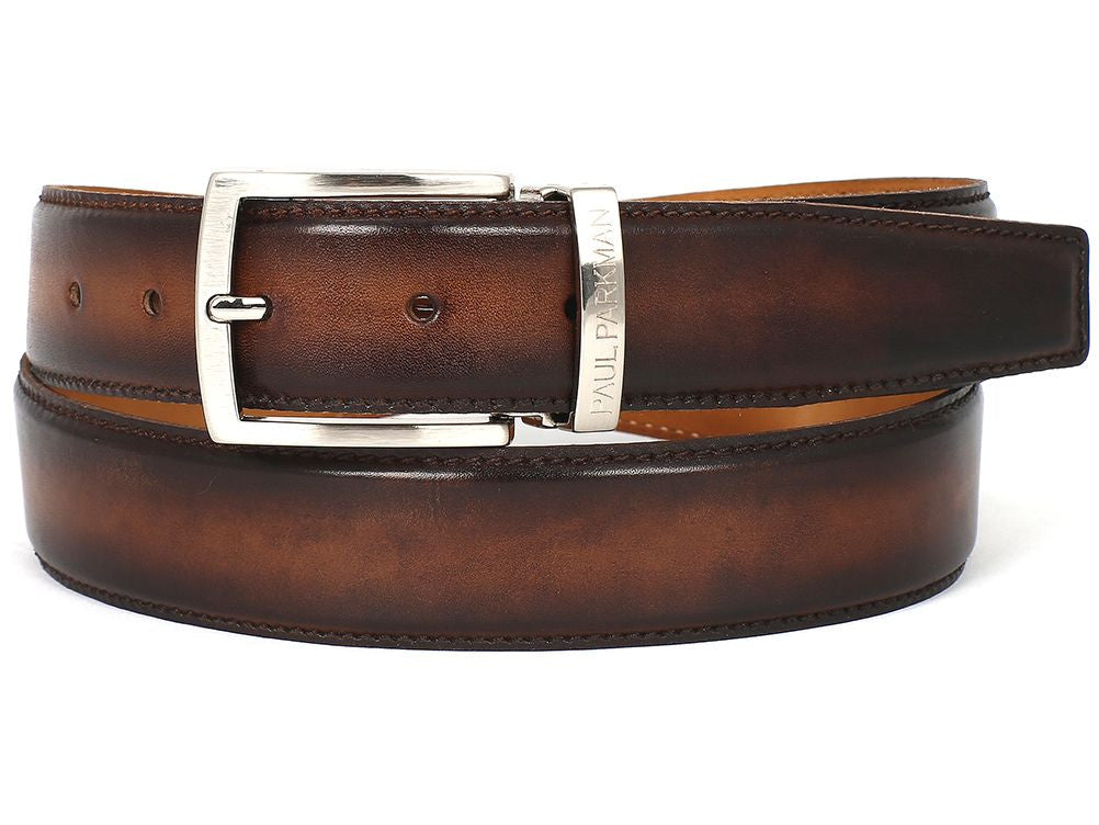 The "Paul Parkman Leather Belt Hand-Painted Brown and Camel" (B01-BRWCML) features exquisite craftsmanship in Italian calfskin leather with a silver buckle engraved with "Paul Parkman" on the loop. This hand-painted, made-to-order belt, shown coiled, is perfect for those who appreciate fine craftsmanship.