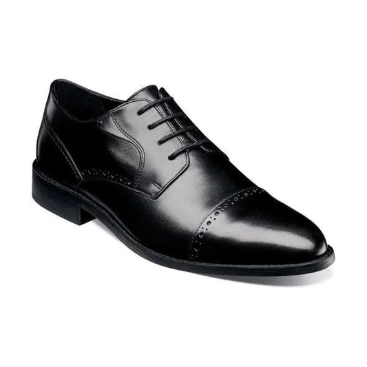 Side view of the Stacy Adams - BARNETT Cap Toe Oxford, model 20196-001 in black, crafted from burnished leather with laces and decorative perforations, featuring a comfortable memory foam footbed.