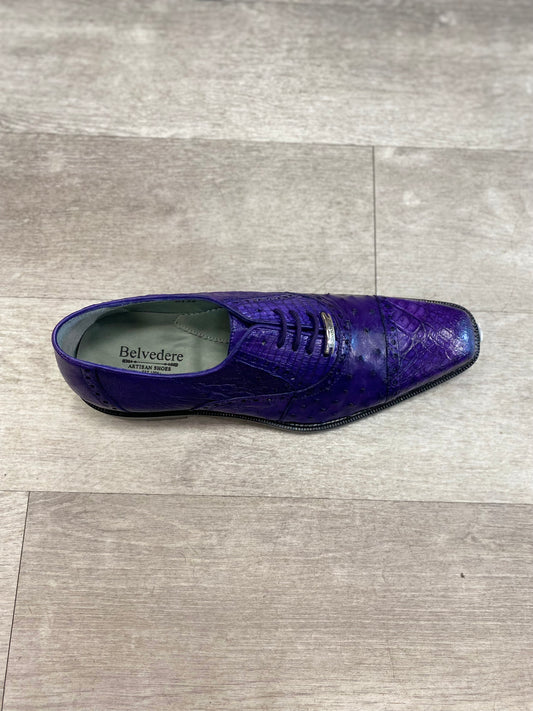 A solitary purple Belvedere Onesto II dress shoe, crafted with a textured design and luxurious genuine ostrich and caiman crocodilus leather lining, showcased on a light gray wood floor.