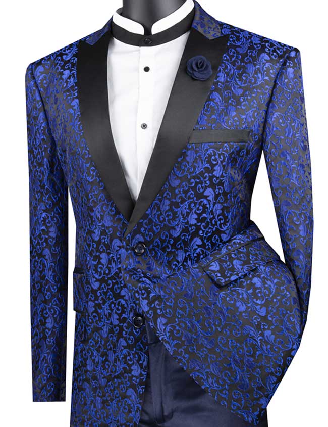 The Vinci Regular Fit Floral Pattern Jacket Peak Lapel (Blue) BF-2 by Vinci Suits showcases a blue floral design with contrasting black lapels and comes with a coordinating pocket square. Made from a comfortable poly/rayon blend, it pairs effortlessly over a white shirt featuring a crisp black collar for an elegant and stylish appearance.