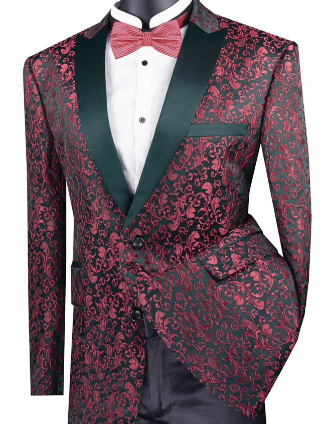 The Vinci Suits "Vinci Regular Fit Floral Pattern Jacket Peak Lapel (Red) BF-2" features a black background adorned with a red floral pattern, complemented by black lapels and paired with a red bow tie over a white shirt. Its single-breasted design adds an elegant touch to this stylish ensemble.