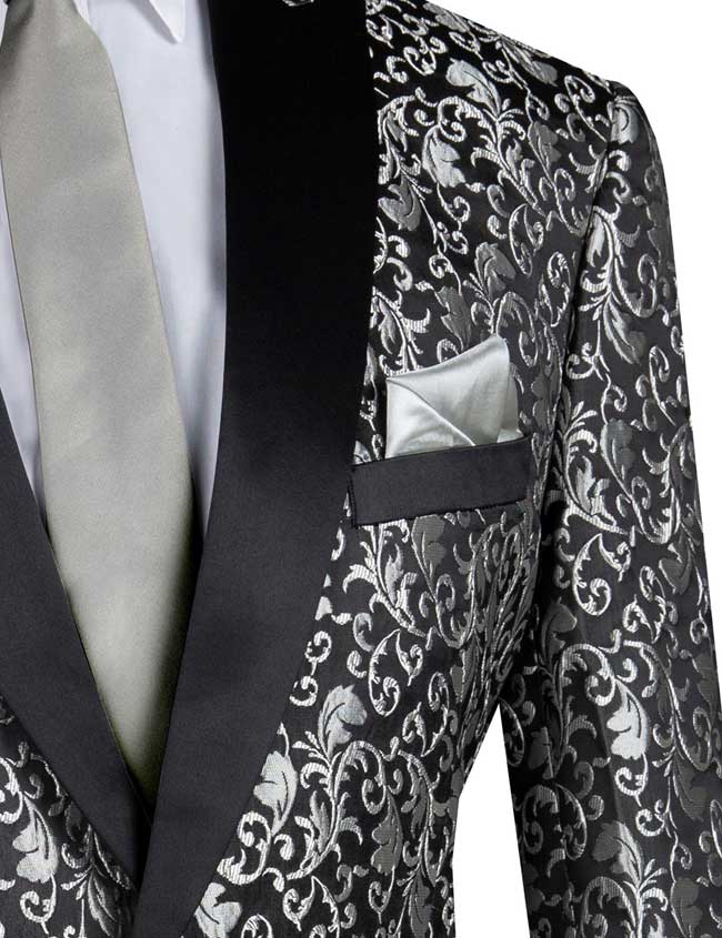 A mannequin wears a Vinci Regular Fit Floral Pattern Jacket with peak lapels in black, paired with a white shirt, gray tie, and a light green pocket square.