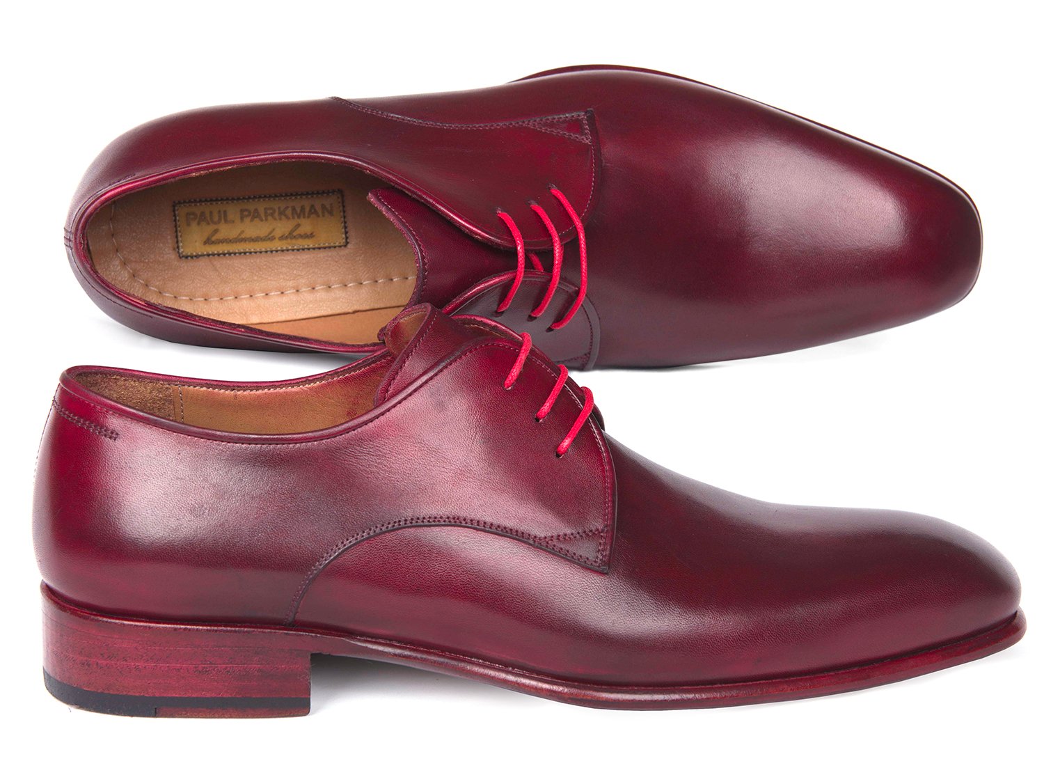 The Paul Parkman Burgundy Hand Painted Derby Shoes - 633BRD72 feature a polished burgundy leather finish with red laces, showcasing a classic derby design and low stacked heels. These made-to-order shoes from Paul Parkman are crafted with a luxurious calfskin upper and meticulous craftsmanship, ensuring both style and comfort with every step.