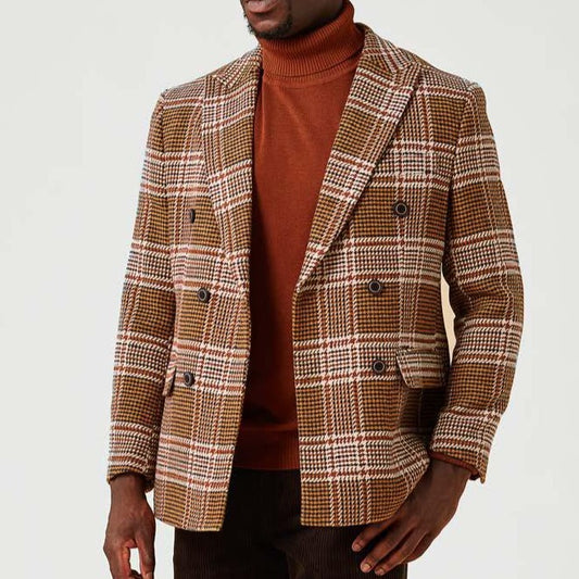 A person is wearing an Inserch Double Breasted Large Plaid Blazer in khaki over an orange turtleneck sweater.