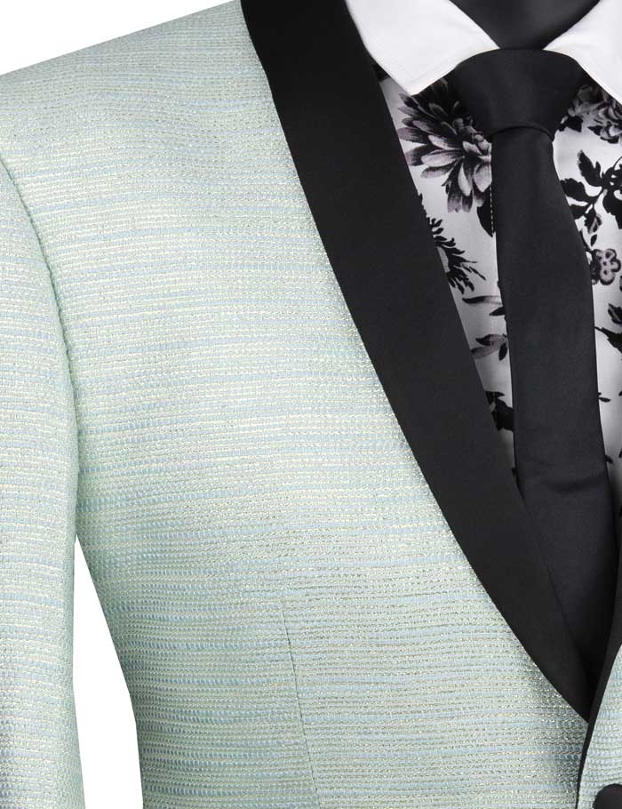 A Vinci Suits slim fit metallic stripe jacket in aqua, featuring a black satin shawl lapel, is paired with a white shirt adorned with black lace detailing and a classic black tie.