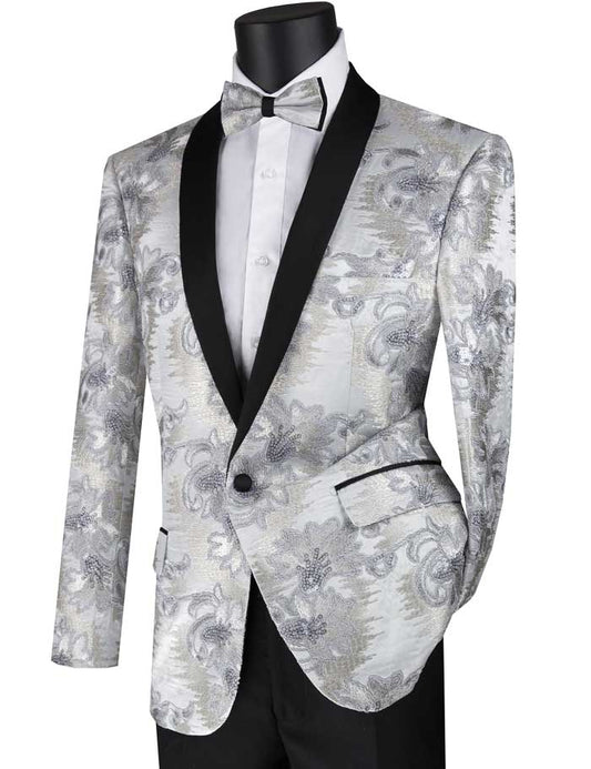 A mannequin is elegantly dressed in the Vinci Suits BSF-13 jacket, a slim fit silver blazer with an embroidered shawl lapel, expertly paired with a white dress shirt and a wrinkle-resistant silver bow tie.