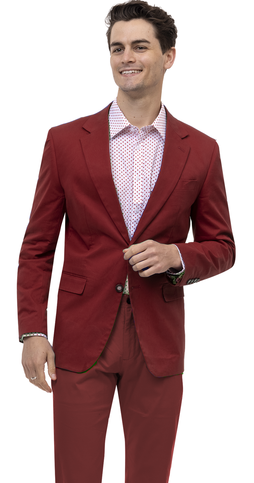 A man in a striking EJ Samuel Burgundy Solid Chino Blazer CHJ01, complemented by a white polka dot shirt and sharp ensemble, stands smiling.