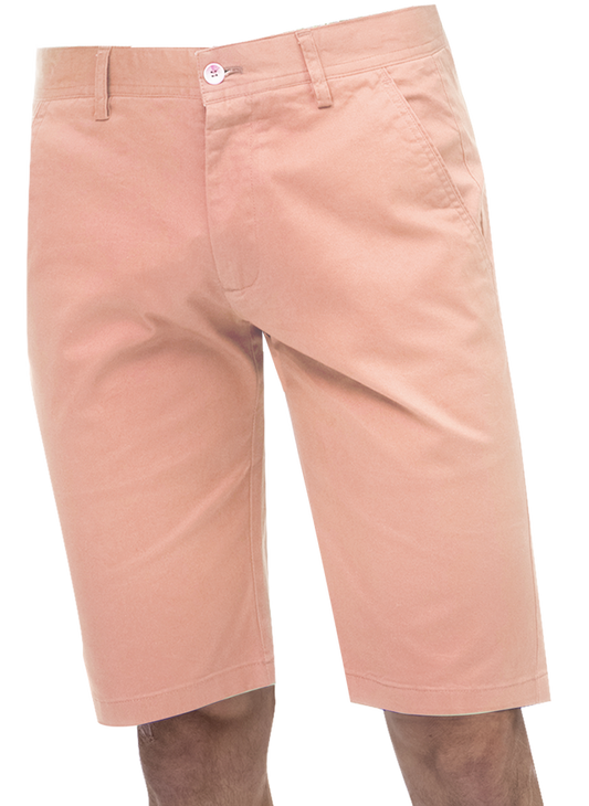 A man wearing the EJ Samuel Pink Chino Short Pants CHS01 by EJ SAMUEL, his hands tucked casually in the pockets, stands against a plain white background.