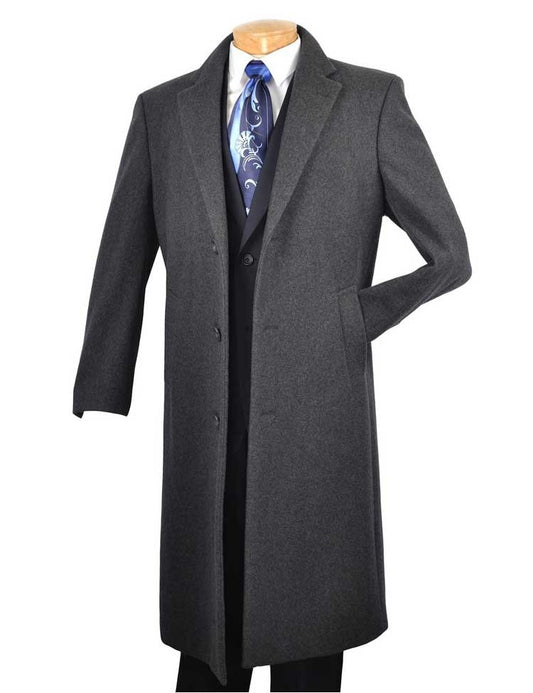 The sophisticated Vinci 48" Long Dress Top Coat in Charcoal by Vinci Suits is displayed on a mannequin, gracefully layered over a black suit paired with a blue patterned tie.