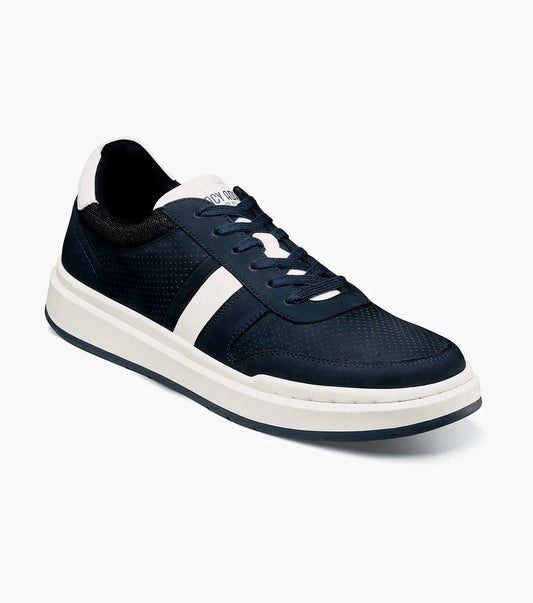 The Stacy Adams CURRIER Moc Toe Lace Up Sneaker in navy showcases a cushioned insole and is designed with white soles and a white side stripe, expertly laced up against a pristine white backdrop.