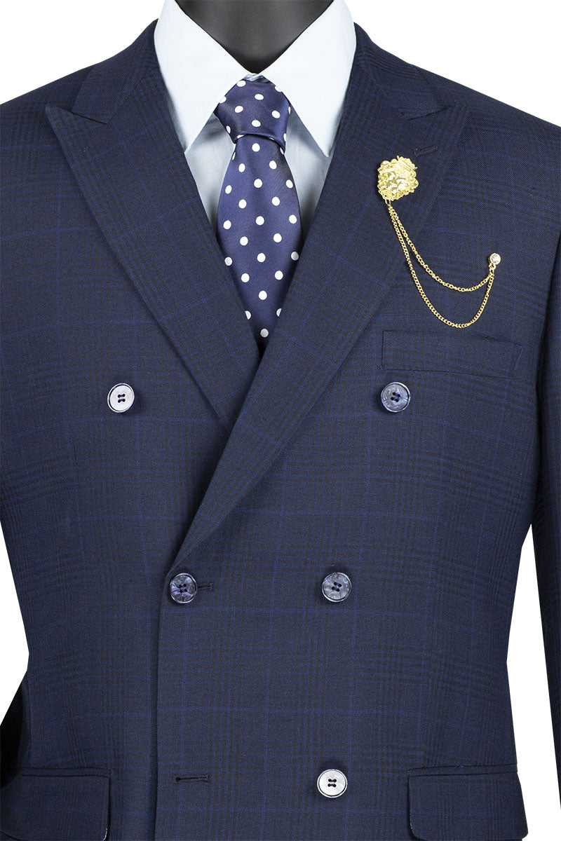 Showcasing the Vinci Executive 2 Piece Double Breasted Windowpane Suit in navy blue by Vinci Suits, this stylish ensemble includes pants and features a crisp white shirt, polka dot tie, and a gold lapel chain elegantly displayed on the mannequin.