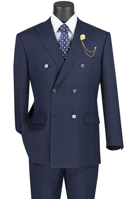 Showcasing the Vinci Executive 2 Piece Double Breasted Windowpane Suit in navy blue by Vinci Suits, this stylish ensemble includes pants and features a crisp white shirt, polka dot tie, and a gold lapel chain elegantly displayed on the mannequin.