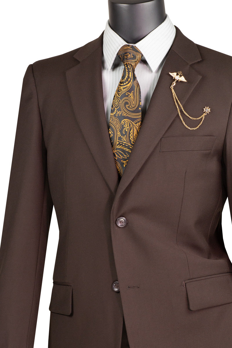 Displayed on a mannequin, the Vinci Executive 2 Piece Suit with a 2″ adjustable waistband in brown from Vinci Suits exudes luxury with its wool-like feel. It's complemented by a striped shirt and paisley tie, accessorized with a gold chain and lapel brooch for the perfect blend of comfort and style.